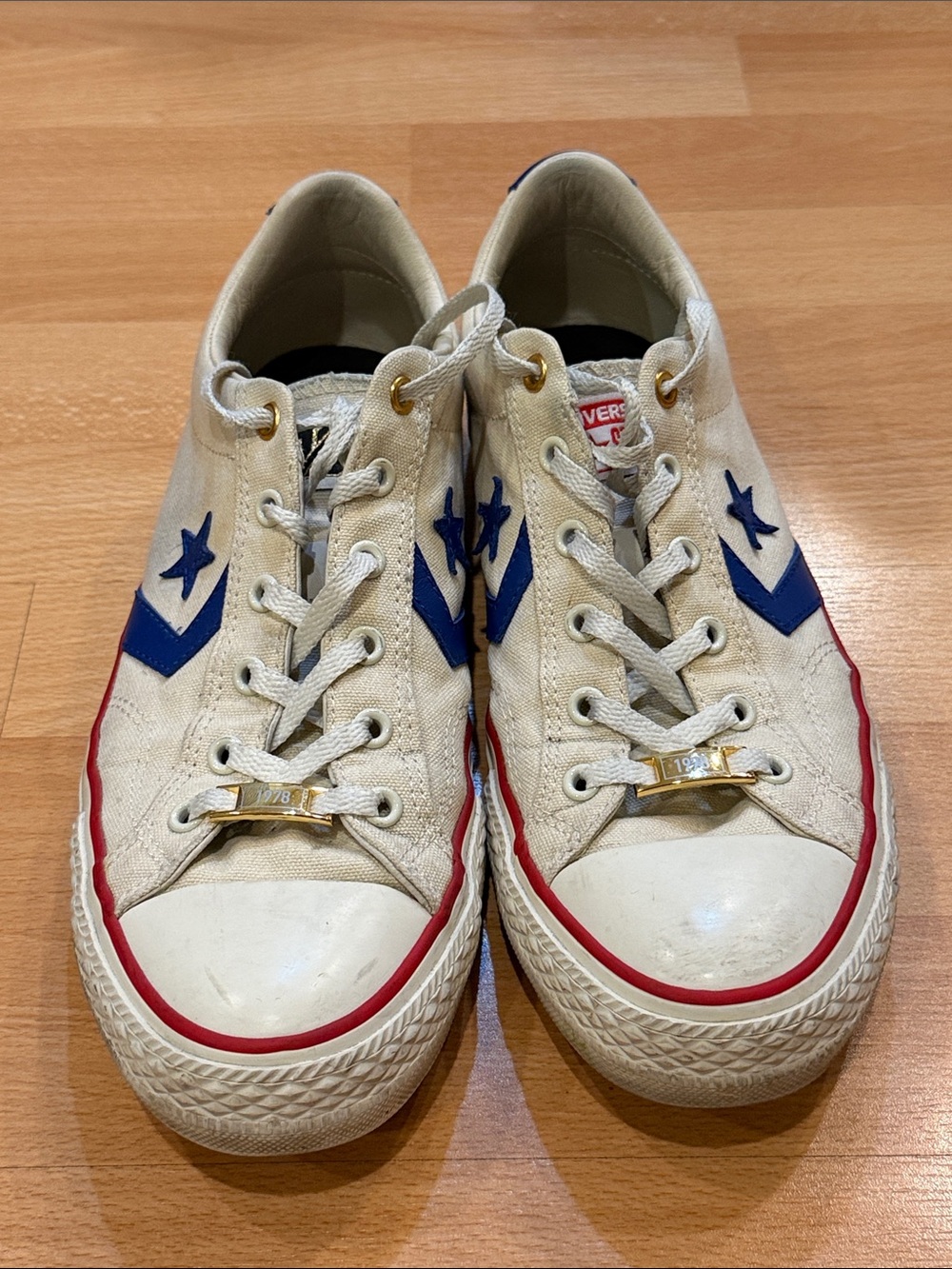 Converse Men’s Low-Top Sneakers in White with Blue and Red Accents